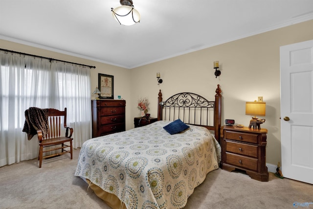 bedroom featuring light carpet, crown molding, and baseboards