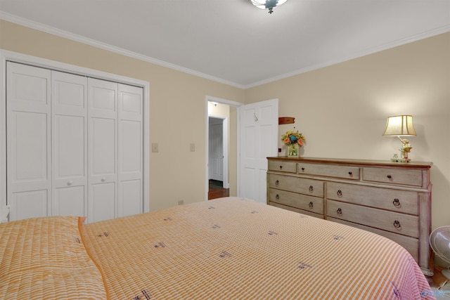 bedroom with ornamental molding and a closet