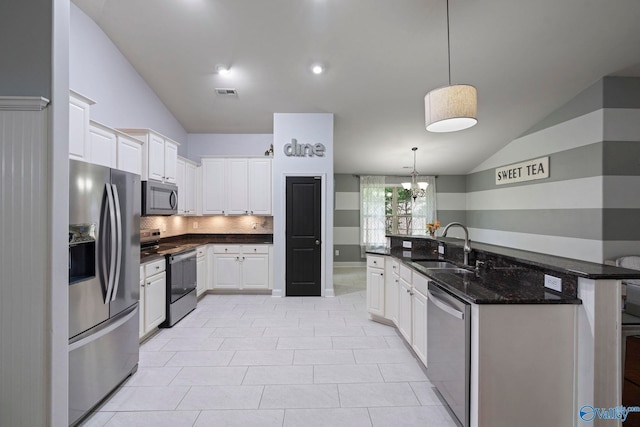6807 Breyerton Way SE, Owens Cross Roads, AL 35763 - kitchen featuring appliances with stainless steel finishes, lofted ceiling, a sink, backsplash, and white cabinets