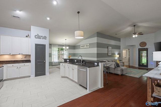 6807 Breyerton Way SE, Owens Cross Roads, AL 35763 - kitchen with stainless steel dishwasher, a sink, open floor plan, white cabinetry, and lofted ceiling