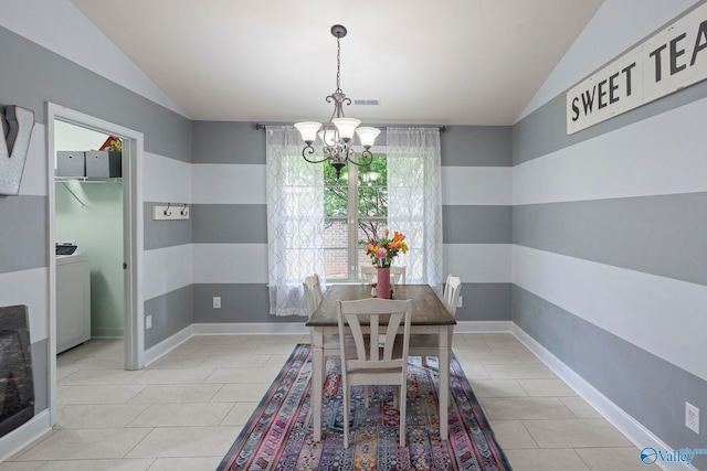 6807 Breyerton Way SE, Owens Cross Roads, AL 35763 - dining space featuring lofted ceiling, a chandelier, light tile patterned floors, washer / clothes dryer, and baseboards