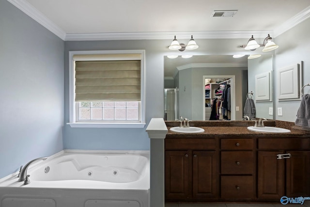 6807 Breyerton Way SE, Owens Cross Roads, AL 35763 - bathroom featuring a tub with jets, ornamental molding, double vanity, a shower stall, and a walk in closet