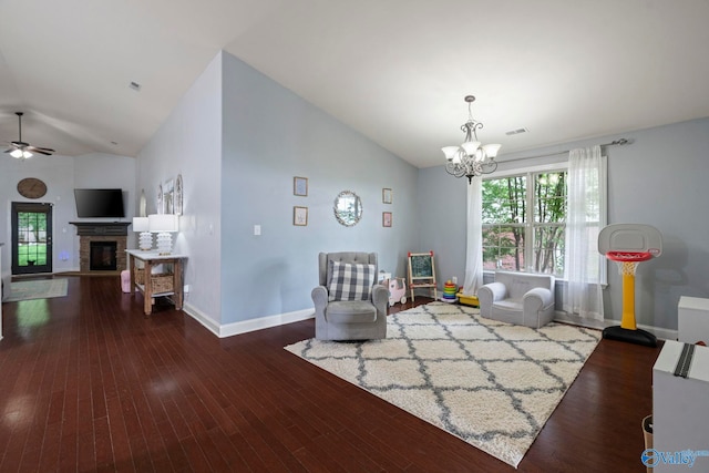 6807 Breyerton Way SE, Owens Cross Roads, AL 35763 - living area featuring a chandelier, baseboards, ceiling fan, a glass covered fireplace, and wood finished floors