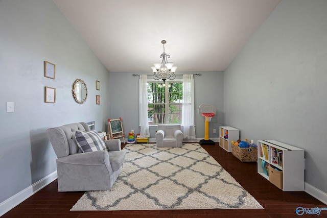 6807 Breyerton Way SE, Owens Cross Roads, AL 35763 - living area featuring a chandelier, dark wood-style floors, baseboards, and lofted ceiling