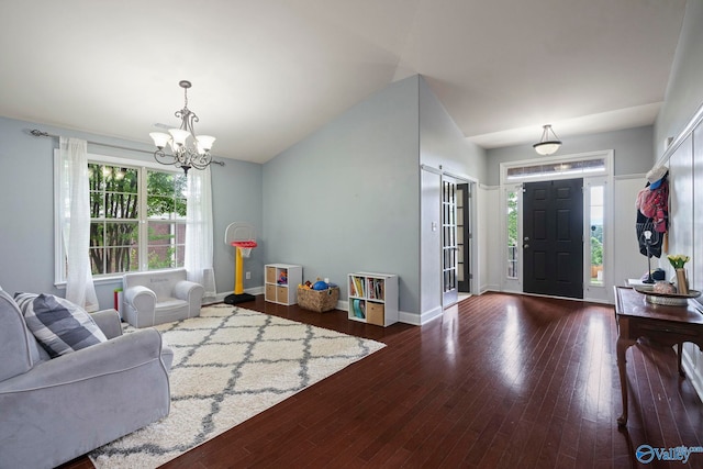 6807 Breyerton Way SE, Owens Cross Roads, AL 35763 - entrance foyer featuring a chandelier, wood finished floors, baseboards, and lofted ceiling