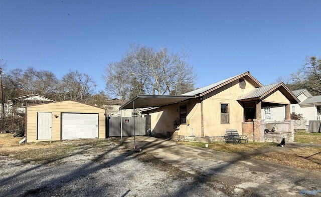 view of front of home featuring a garage and an outdoor structure