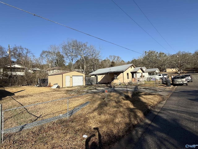 view of front facade with a garage and an outdoor structure