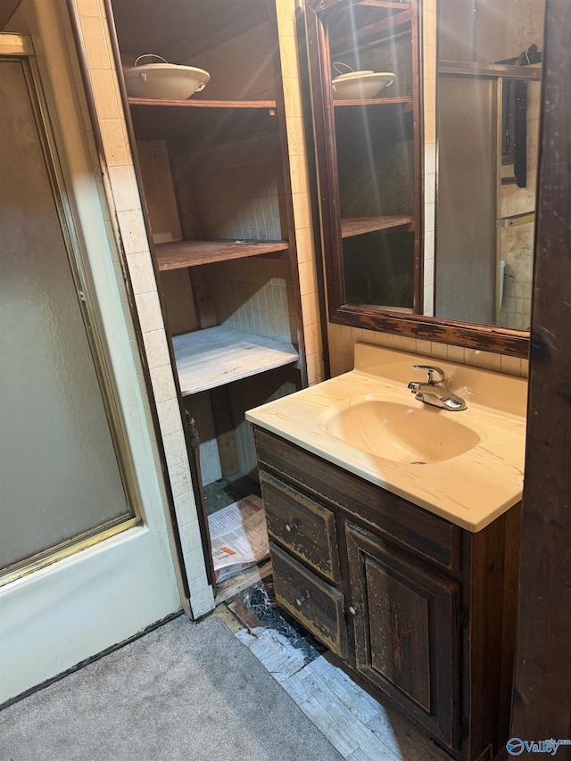 bathroom featuring vanity and walk in shower