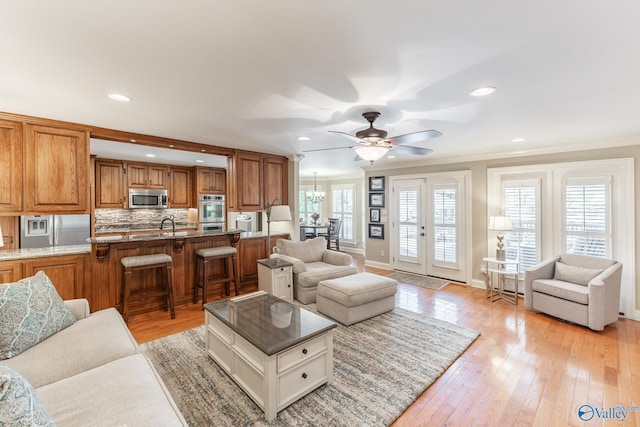 406 Zandale Dr SW, Huntsville, AL 35801 - living area featuring a ceiling fan, light wood finished floors, baseboards, crown molding, and recessed lighting