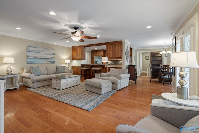 406 Zandale Dr SW, Huntsville, AL 35801 - living room featuring a chandelier, crown molding, ceiling fan, light wood-style flooring, and recessed lighting