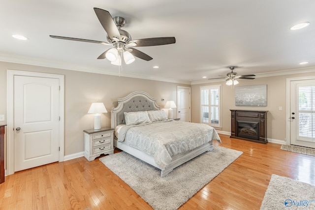 406 Zandale Dr SW, Huntsville, AL 35801 - bedroom featuring baseboards, light wood-style flooring, ornamental molding, recessed lighting, and a glass covered fireplace