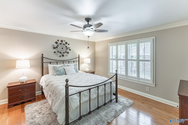406 Zandale Dr SW, Huntsville, AL 35801 - bedroom with wood finished floors, ornamental molding, baseboards, and ceiling fan