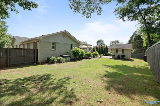 406 Zandale Dr SW, Huntsville, AL 35801 - view of yard featuring central AC unit and an outdoor structure