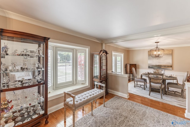 406 Zandale Dr SW, Huntsville, AL 35801 - dining area featuring wood finished floors, plenty of natural light, crown molding, a chandelier, and baseboards