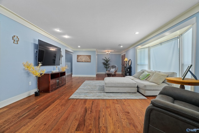 living room with ornamental molding and hardwood / wood-style floors