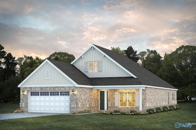 view of front of home with a front yard, concrete driveway, brick siding, and an attached garage