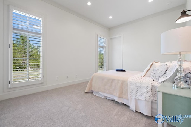 bedroom with carpet flooring, multiple windows, baseboards, and recessed lighting