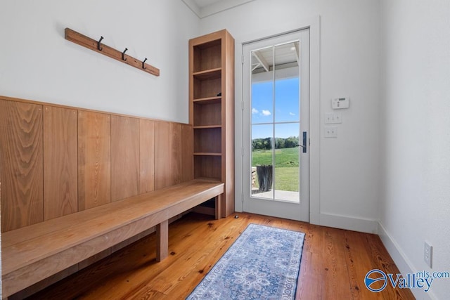 mudroom with baseboards and wood finished floors