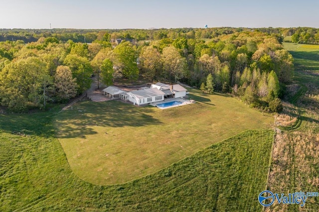birds eye view of property with a rural view and a forest view