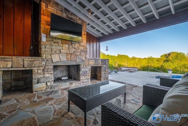 view of patio featuring an outdoor living space with a fireplace