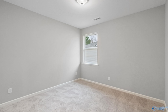 spare room featuring carpet flooring