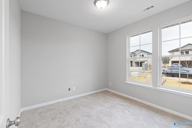 unfurnished room featuring carpet flooring