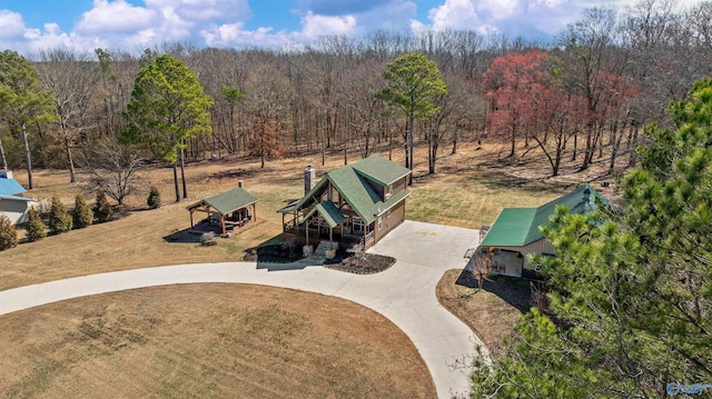 aerial view featuring a wooded view