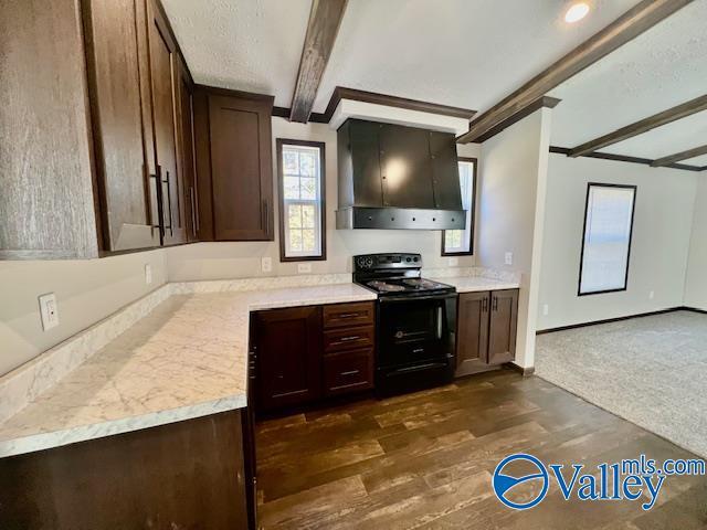 kitchen with beamed ceiling, dark brown cabinets, custom range hood, and black / electric stove