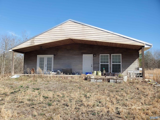 back of house featuring french doors