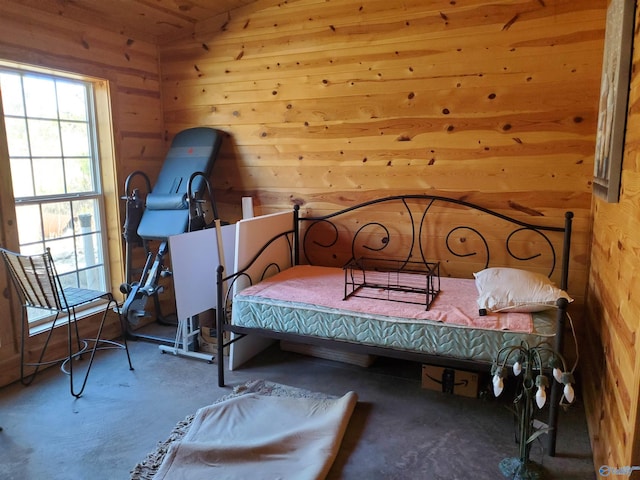 bedroom with wood walls