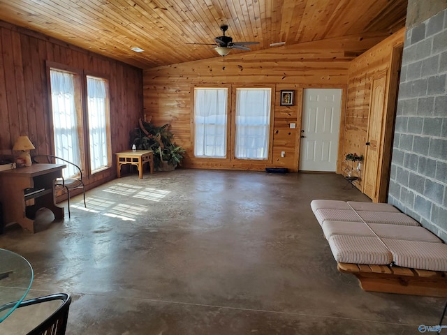 unfurnished room featuring lofted ceiling, wood ceiling, and concrete flooring