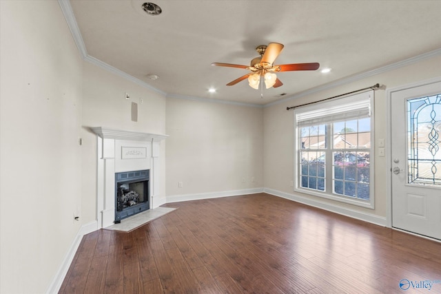 unfurnished living room with ceiling fan, ornamental molding, and dark hardwood / wood-style floors