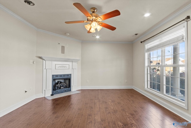 unfurnished living room featuring hardwood / wood-style floors, ceiling fan, and ornamental molding