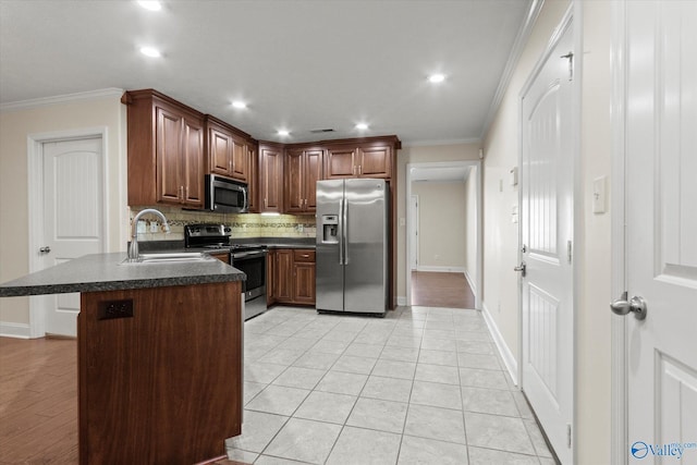 kitchen featuring stainless steel appliances, ornamental molding, light tile patterned floors, and sink