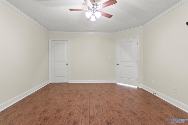 spare room with hardwood / wood-style flooring, ceiling fan, and ornamental molding