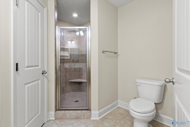 bathroom with a textured ceiling, vaulted ceiling, tile patterned flooring, toilet, and a shower with door