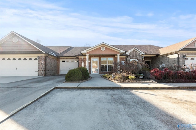 single story home with a garage