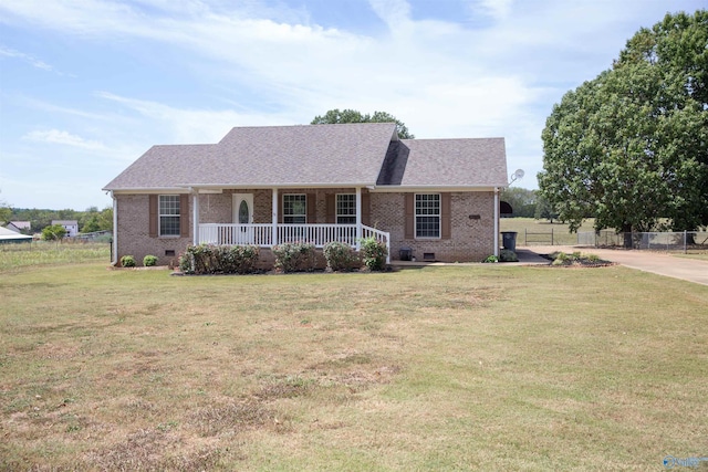 ranch-style house featuring crawl space, covered porch, brick siding, and a front lawn