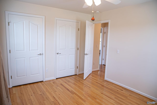 unfurnished bedroom featuring light wood-type flooring and baseboards