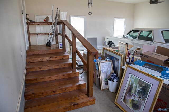 stairs featuring concrete floors