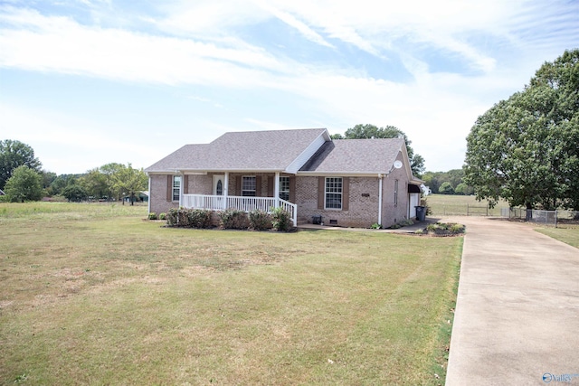 view of front facade with covered porch, brick siding, crawl space, and a front yard