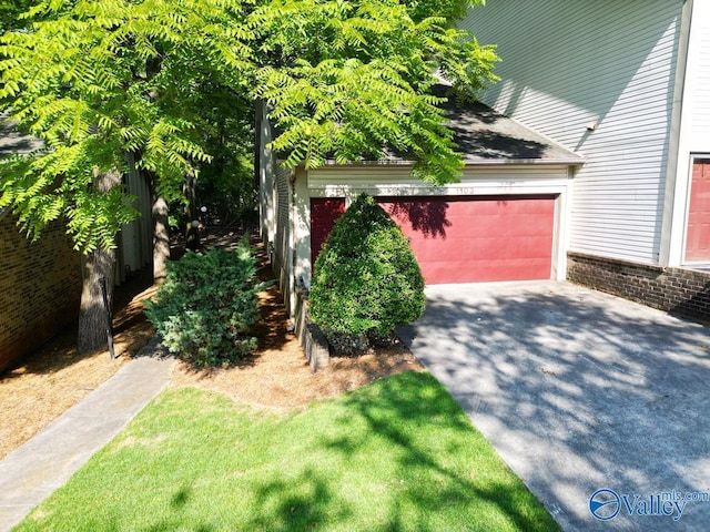 garage featuring aphalt driveway