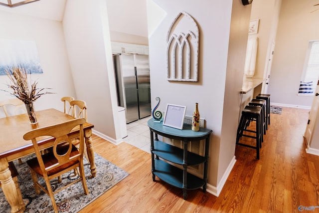 dining space with light wood-type flooring