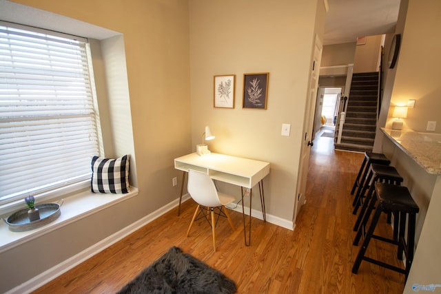 office space with hardwood / wood-style flooring