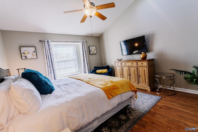 bedroom with lofted ceiling, dark wood-type flooring, and ceiling fan