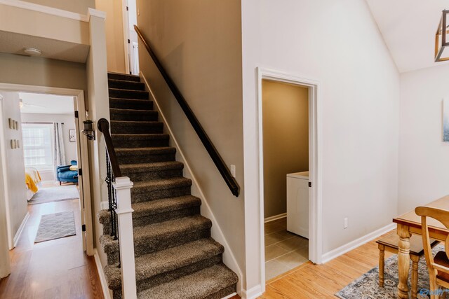 staircase with hardwood / wood-style floors