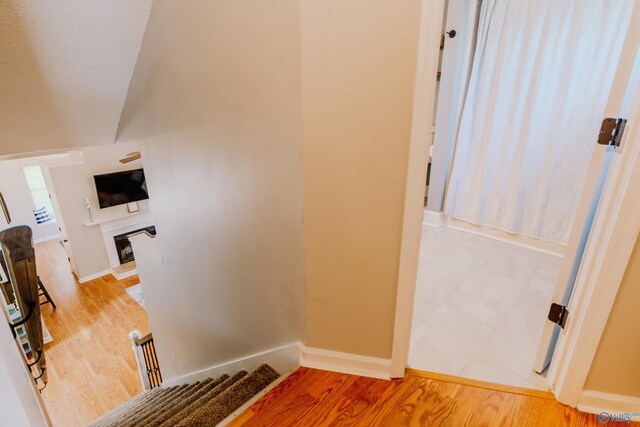 stairs featuring wood-type flooring