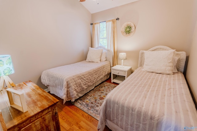 bedroom with hardwood / wood-style flooring and ceiling fan