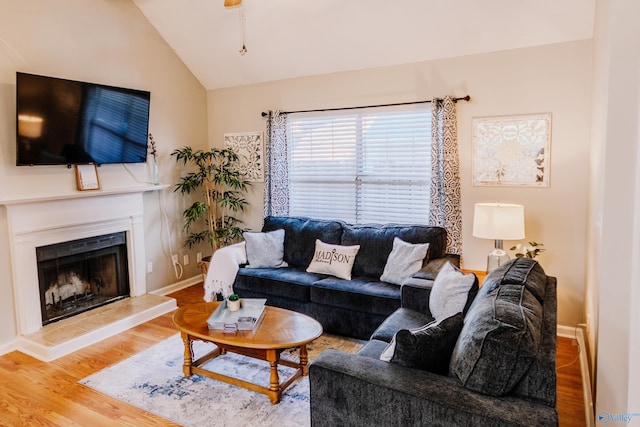 living room with lofted ceiling and hardwood / wood-style floors