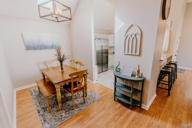 dining room featuring an inviting chandelier and light hardwood / wood-style floors